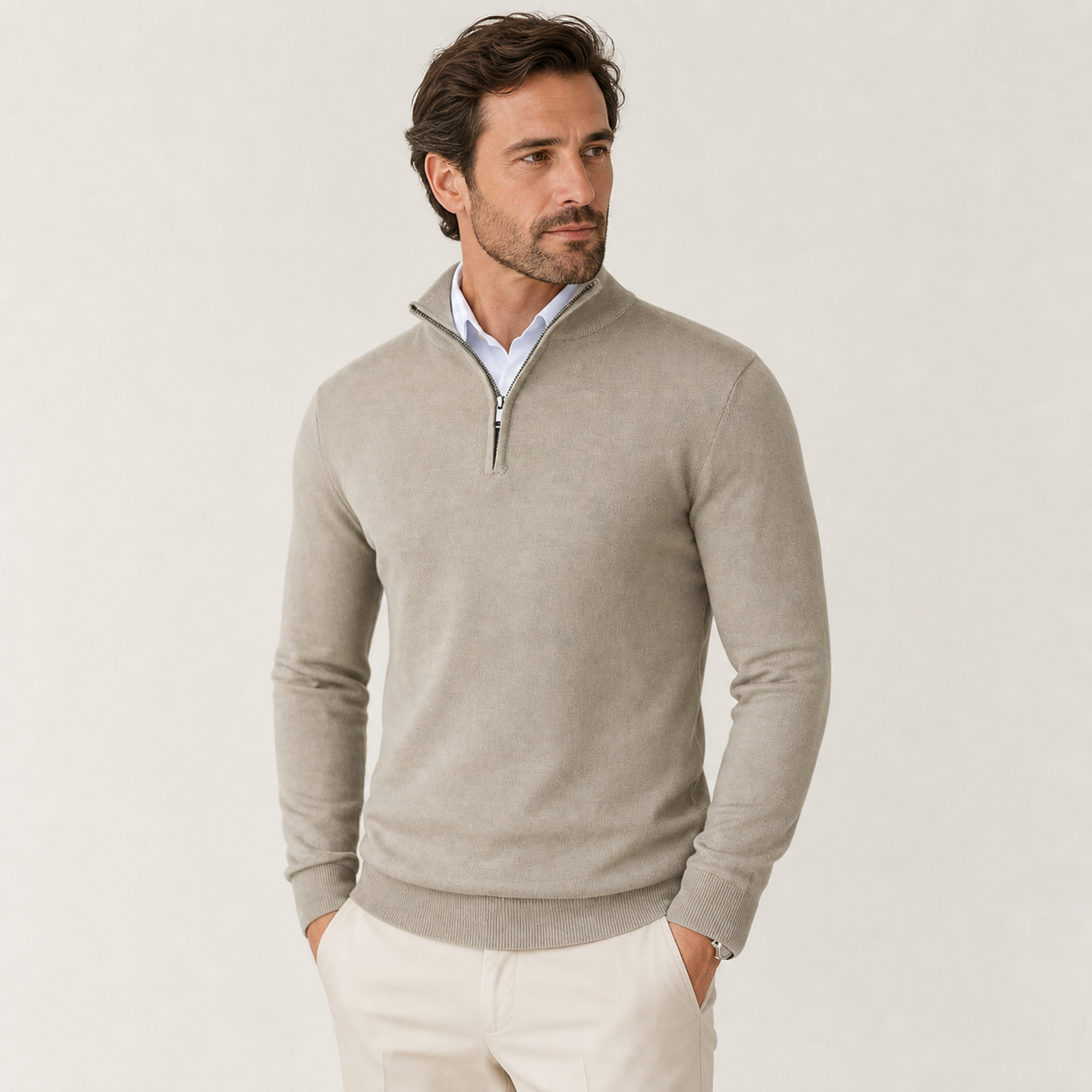 Man styling the beige quarter-zip sweater outdoors