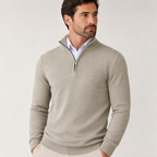 Close editorial view of the beige quarter-zip sweater