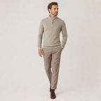 Man walking in the beige quarter-zip sweater