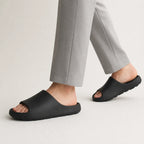 Black EVA platform slide slippers in motion