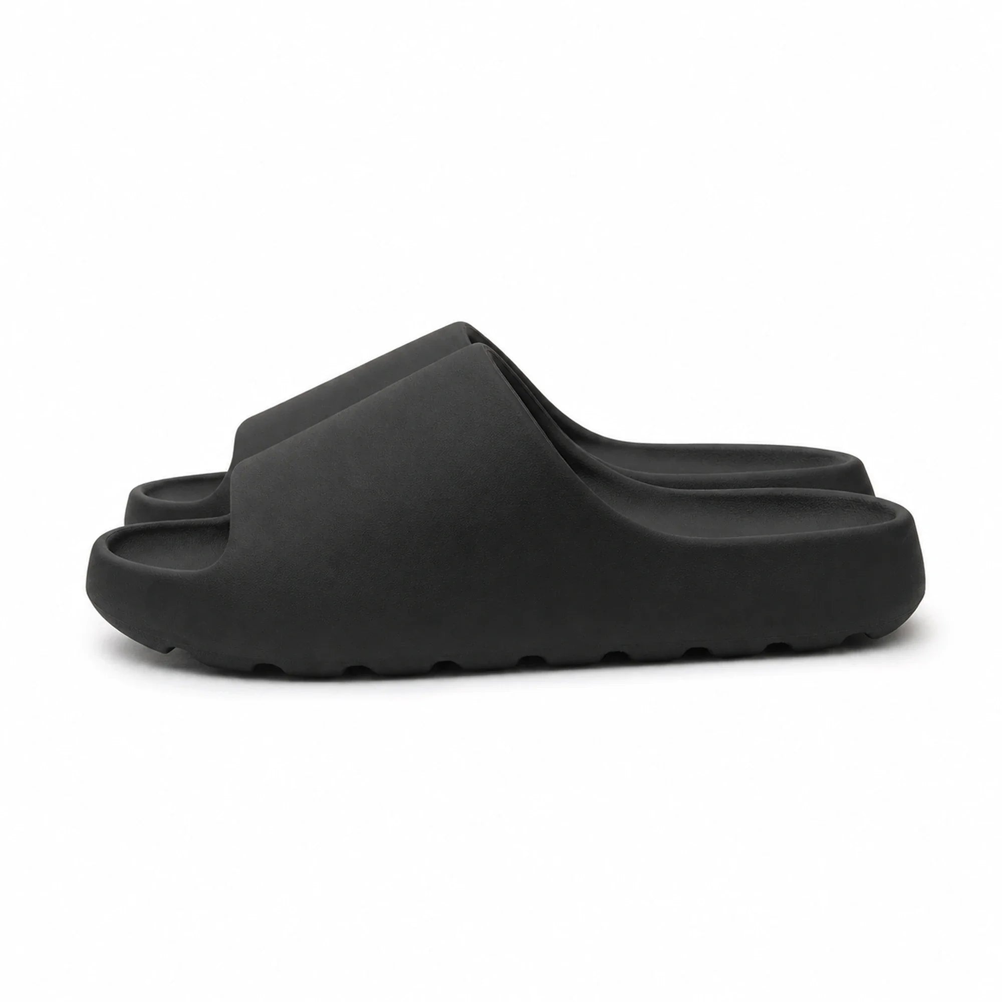 Black EVA platform slide slippers side view on white