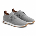 Men's gray knit sock-fit sneaker, diagonal view on white