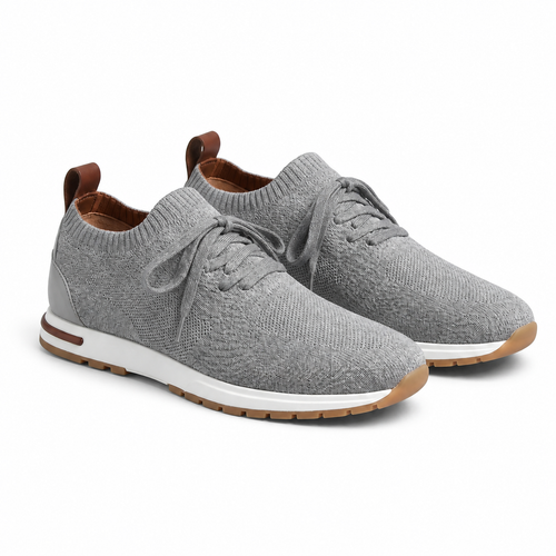 Men's gray knit sock-fit sneaker, diagonal view on white