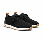 Men's black knit sock-fit sneaker, diagonal view on white