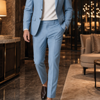 Men's light blue suit styled in a hotel lobby