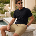 Men wearing khaki waffle-textured shorts seated at a resort