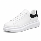 Men's white platform sneaker with black heel, diagonal view