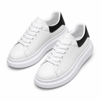 Men's white platform sneakers with black heel, pair view