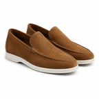 Men's brown suede slip-on loafers, diagonal view on white