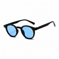 PALMA polarized round sunglasses, black frame with blue lens, diagonal view on pure white